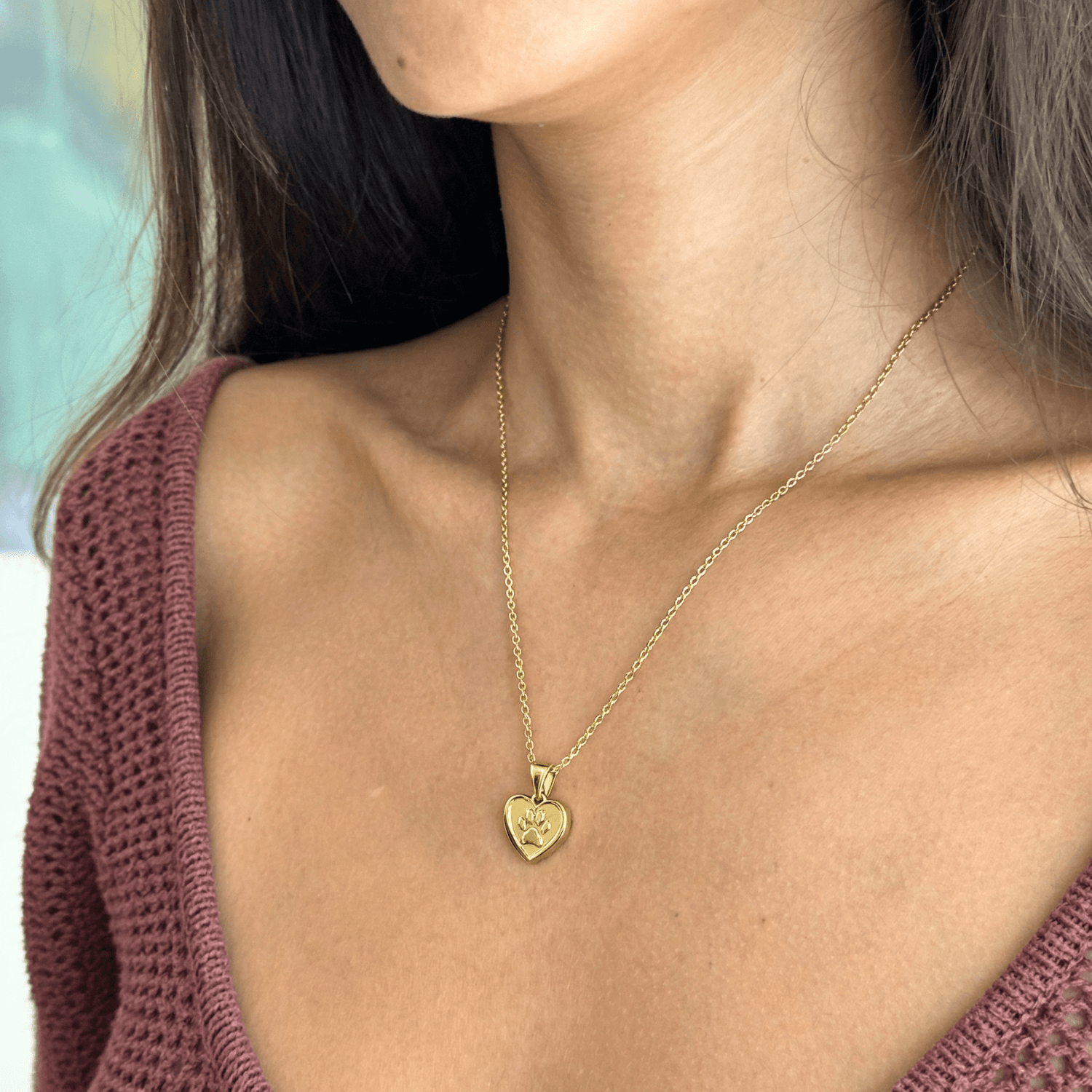 Gold paw and heart dog charity necklace that helps fund 30 shelter meals